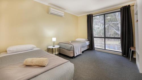 Voodi või voodid majutusasutuse Deni Golf Resort toas