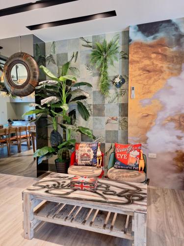 a living room with a coffee table and a mural at Villa Ten - Swing screw in Guilin