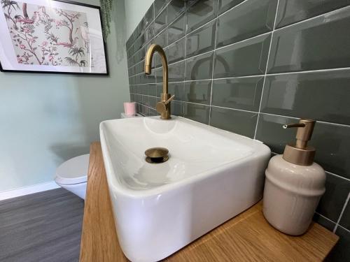 a bathroom with a white sink and a toilet at Casa da Calabra by Trip2Portugal in Cedovim