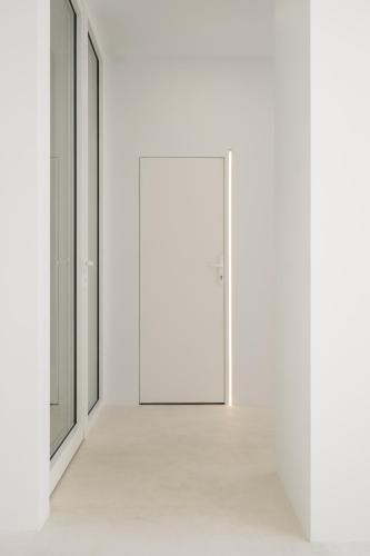 an empty corridor with a door in a white room at Hotel Hello Plovdiv - Free Parking and Pet Friendly in Plovdiv