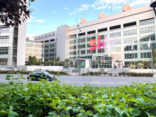 a large building with a samsung sign on it at Santa Giulia Terrace - 15 Mins City Center in Linate