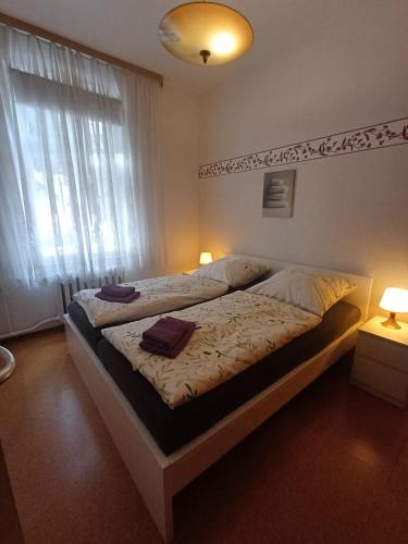 a bedroom with a bed with two pillows on it at Ferienwohnung Köppe in Lutherstadt Wittenberg