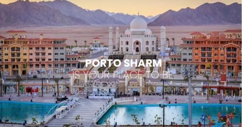 a view of a resort with mountains in the background at Porto Sharm Pool View VIP-Service in Sharm El Sheikh