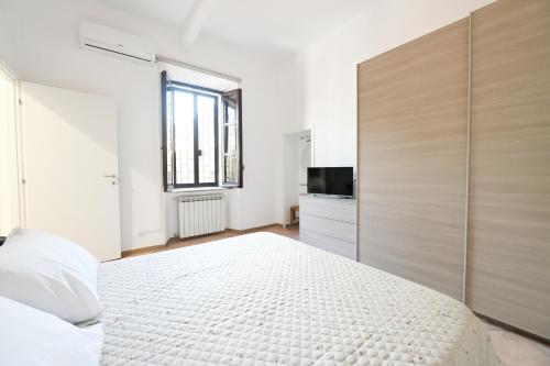 Postel nebo postele na pokoji v ubytování Appartamento con delizioso giardino