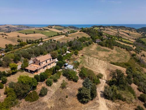 an aerial view of a house on a hill at Villa Dolce Vita - Vista Colline, Jacuzzi, 3Suites & 5min dal mare in Lapedona