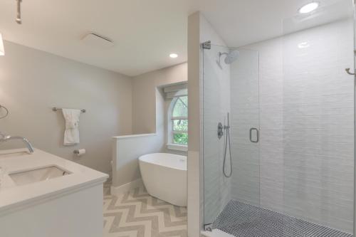 a bathroom with a shower and a sink and a toilet at Beach Please in Sanibel
