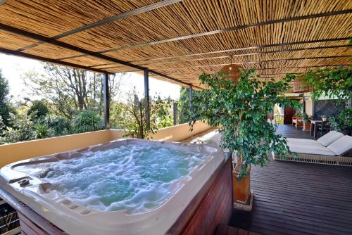a jacuzzi tub sitting on a deck at The Residence in Johannesburg