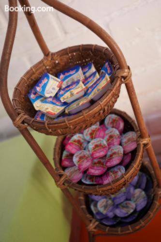 a basket full of candy in a room at Sarinande Hotel in Seminyak