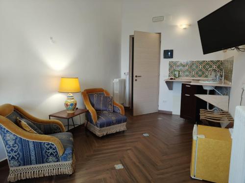 TV o dispositivi per l'intrattenimento presso Centro Sicilia Rooms-Suites & Terrace
