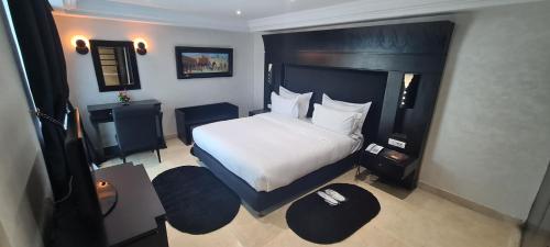 a hotel room with a bed and a desk at Hotel Borj Rabat - A member of Barceló Hotel Group in Rabat