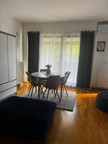 a living room with a table and chairs at Studio apartment Old Town Castle in Samobor