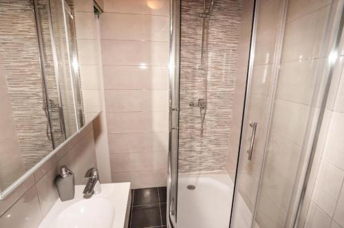 a bathroom with a shower and a sink and a toilet at Ellena Sunshine in Opatija