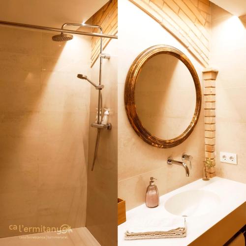 a bathroom with a sink and a mirror at Ca l' Ermitanyo- Casa Torre Blanca in Suria