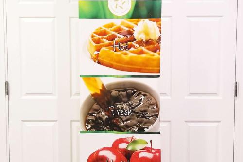 two pictures of waffles and a bowl of fruit at Quality Inn & Suites Cincinnati Sharonville in Sharonville