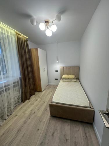 Ένα ή περισσότερα κρεβάτια σε δωμάτιο στο 3комн квартира