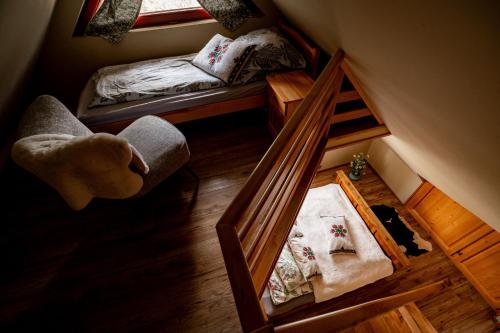 a small room with a bunk bed and a mirror at Apartament nad Potokiem Sauna, Jacuzzi, SPA in Witów