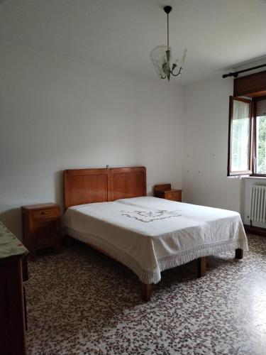 Ένα ή περισσότερα κρεβάτια σε δωμάτιο στο Grande Appartamento in montagna