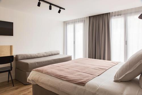 Postel nebo postele na pokoji v ubytování New Hotel Opéra