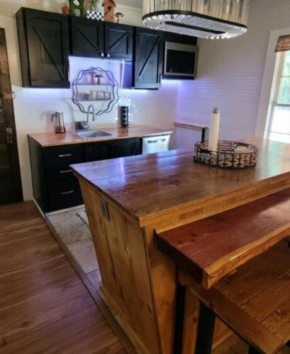 a kitchen with a wooden counter top in a room at Clemson Memorabilia House Frank Howard III Home in Clemson