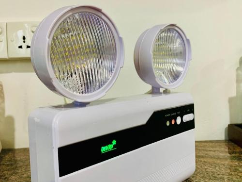 a white appliance with two lights on top of it at 007Dickoya in Dikoya