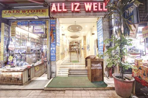 an entrance to a store with a sign that reads all well at Hotel All Iz Well - Traveller Choice Award winner 2025 in New Delhi