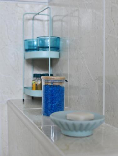 a plate and a bowl on a counter with blue dishes at Studio apartment Old Town Castle in Samobor