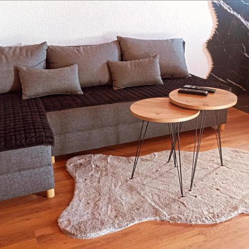 a living room with a couch and a table at 4 brata in Antonići