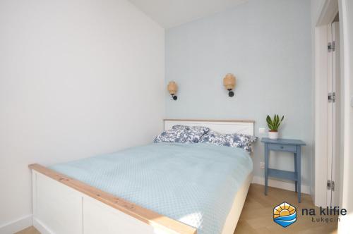 Postel nebo postele na pokoji v ubytování Apartament na klifie - Łukęcin
