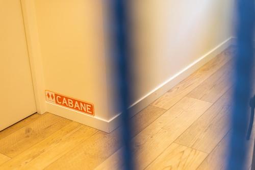a sign that says my garage on the floor of a room at La Sainthilarienne in Saint-Lary-Soulan