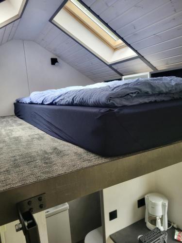 Postel nebo postele na pokoji v ubytování Bigge Elements Tinyhaus 4 "Magie"