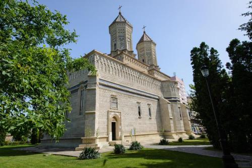 an old building with a tower on top of it at Iasi Ultra Central Apartment Self Check-In in Iaşi