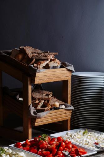 a display of bread and other foods on a table at Hotel Salzburg in Saalbach Hinterglemm