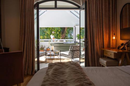 Katil atau katil-katil dalam bilik di Le Petit Manoir Boutique Hotel