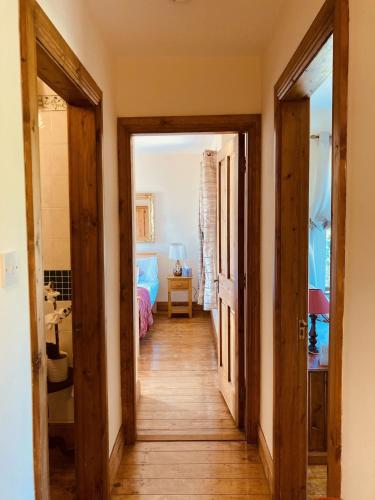 a hallway with two doors leading to a bedroom at No 10 Coastguard Station in Renvyle