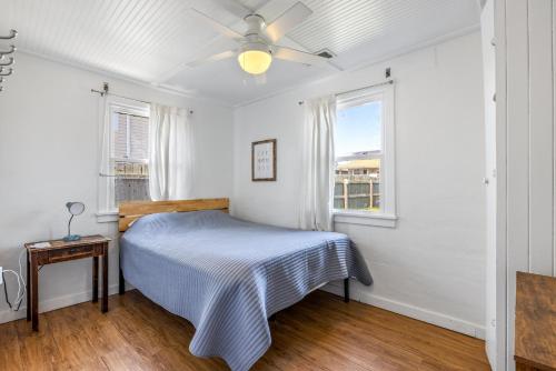 a bedroom with a bed and a ceiling fan at KDH187 Lunar Tide in Kill Devil Hills