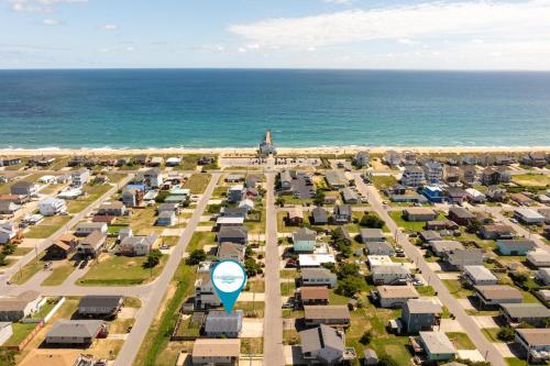 an aerial view of a city with houses and the ocean at KDH187 Lunar Tide in Kill Devil Hills