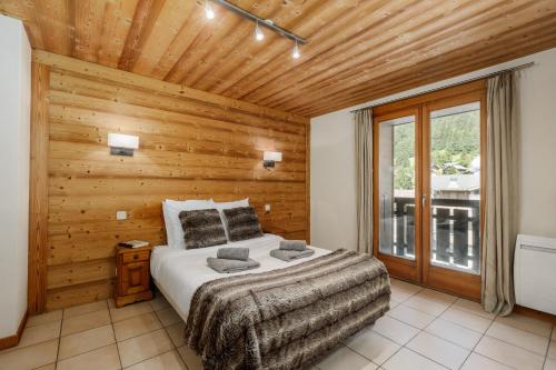 Katil atau katil-katil dalam bilik di Appartement Azalées 5