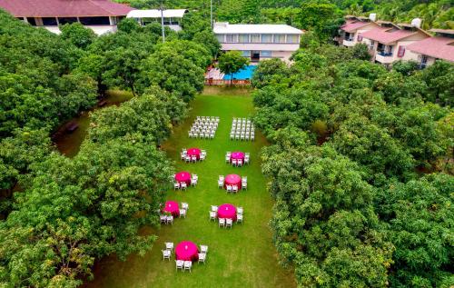 an overhead view of tables and chairs in a park at Freesia Resort by Express Inn in Nashik