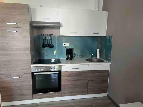 Η κουζίνα ή μικρή κουζίνα στο Appartements Bel Lago Bestensee