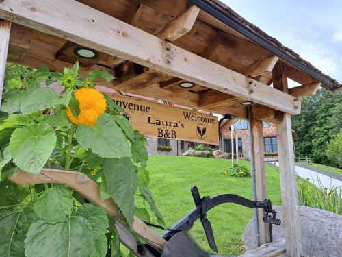 a wooden pergola with a sunflower in a garden at Luxury farm Stay, Alexandria in Glen Robertson