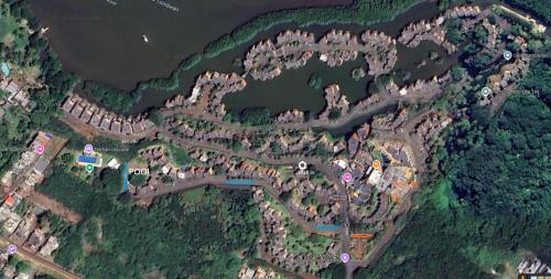 arial view of a park with a lake and water at Port Chambly Riverfront in Terre Rouge