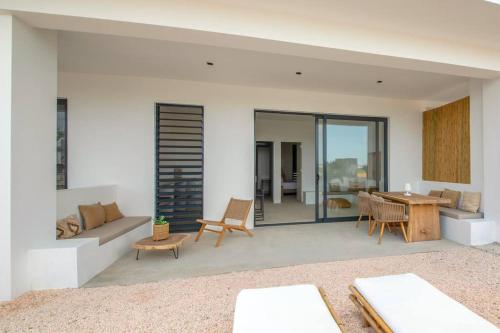 a living room with a couch and a table at Villa NOMA - Apartment with Lovely View I 5 min from Beach I Free SUP in Jan Thiel