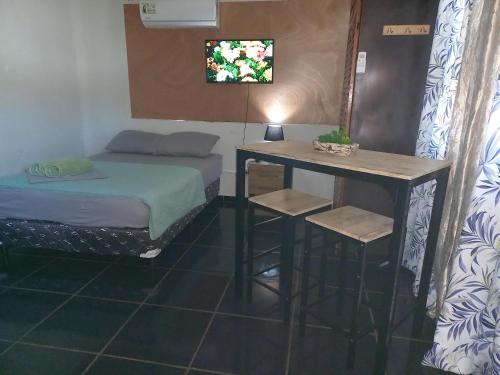Un ou plusieurs lits dans un hébergement de l'établissement Apartahotel los cactus