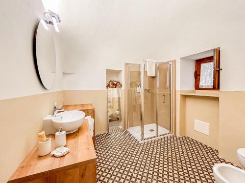 a bathroom with a sink and a shower at I Trulli e la Luna in Alberobello