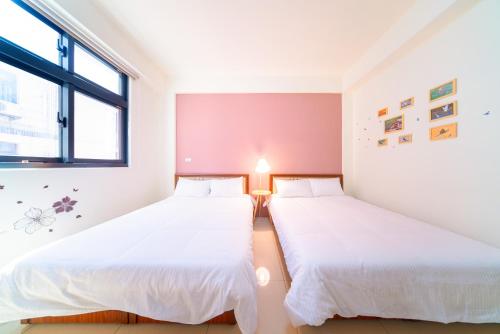 Una cama o camas en una habitación de 熙悅民宿