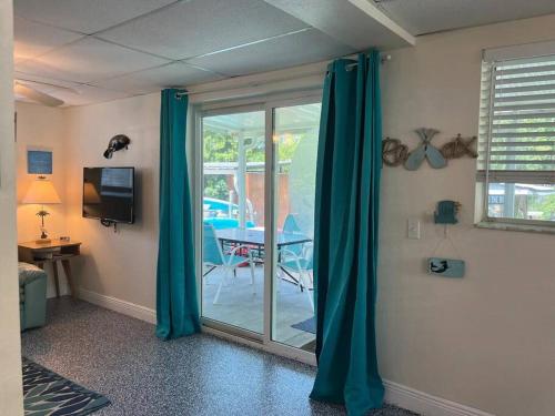 A television and/or entertainment centre at Pirate's Cove - Waterfront - Weeki Wachee River Access with Paddlecraft!!