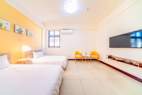 Una cama o camas en una habitación de 熙悅民宿