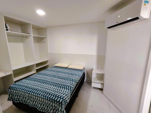Giường trong phòng chung tại Aquarius Residence seu lugar na praia de Iracema
