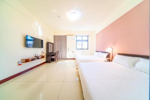 Una cama o camas en una habitación de 熙悅民宿