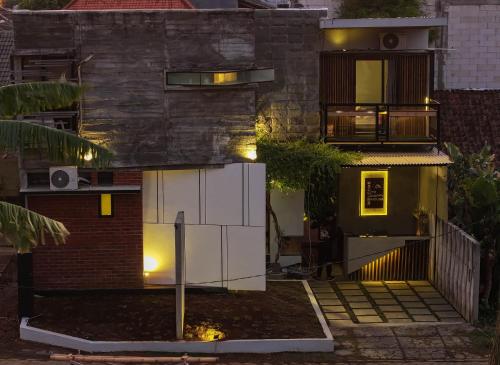 a house with lights on the side of it at Happy House BnB Bromo backpacker in Probolinggo